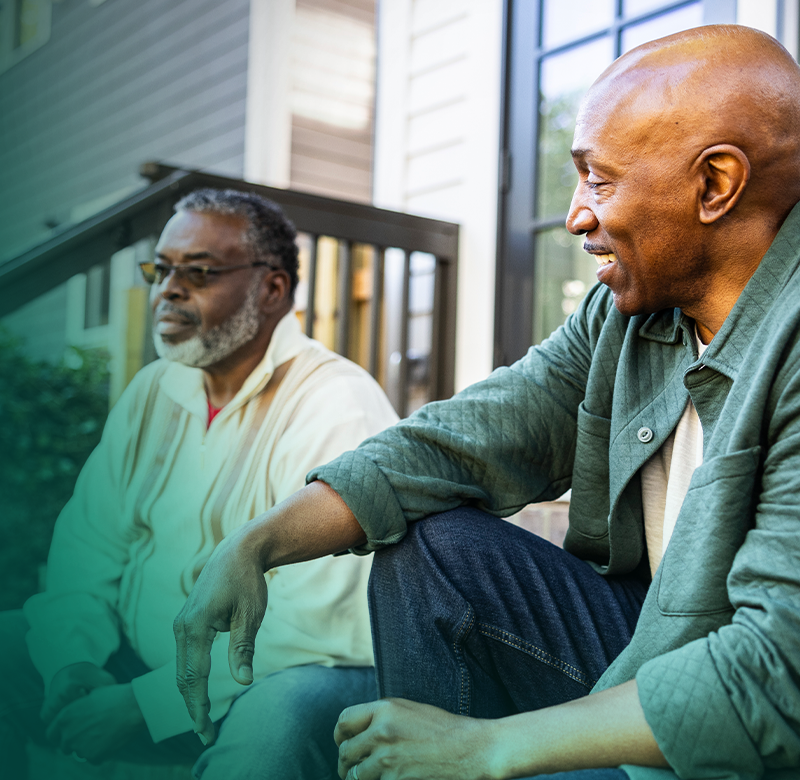 Two People Talking on Porch